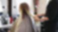 videoblocks-a-blonde-woman-is-sitting-in-front-of-the-mirror-at-the-hairdressers-the-haird