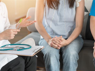 Fertility consultation with doctor and couple.
