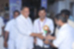 founder giving gift to the chief guest