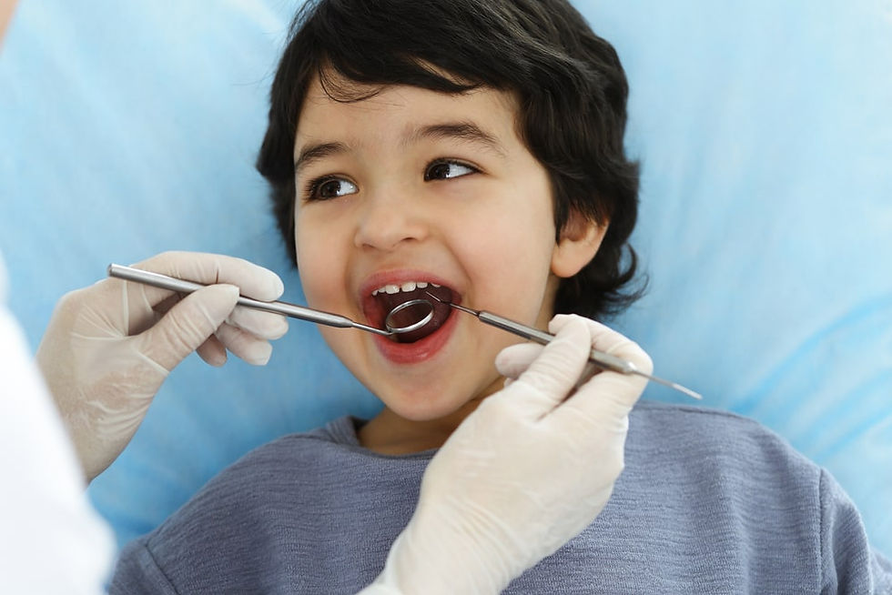 dentist checking the child teeth