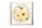 Pressed floral arrangement with yellow and white flowers in a square wooden frame. Soft light, delicate, and botanical display.
