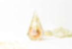 resin ring holder with floral inclusions, set against a white background surrounded by scattered, faded yellow flower petals. Minimalist and serene.