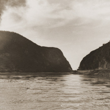 A tugboat tows one of the riverboats of the Kladovo transport away from the Iron Gate at the Romanian border.jpeg