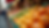Eye-level view of a vibrant farmers' market stall filled with fresh fruits