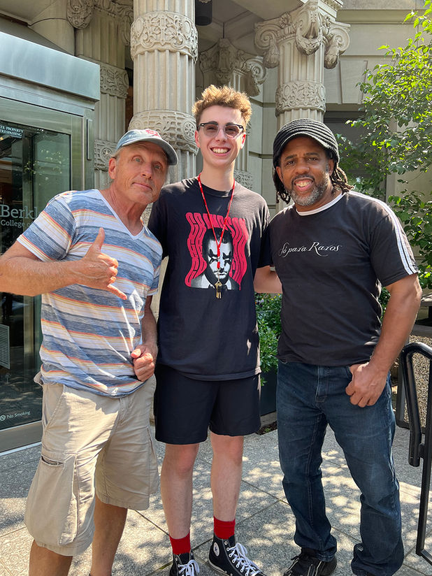 Victor Wooten and Steve Bailey pictured here with musician LAIM Hopkins in front of the Berklee College of Music building in Boston.