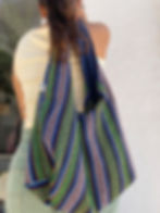 Bohemian-style floral hobo bag in green and blue tones, handmade in Crete with magnetic snap closure.
