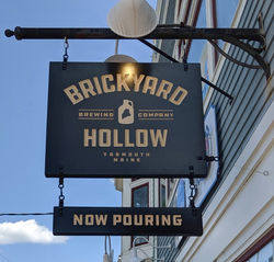Hanging business sign in Freeport, Maine