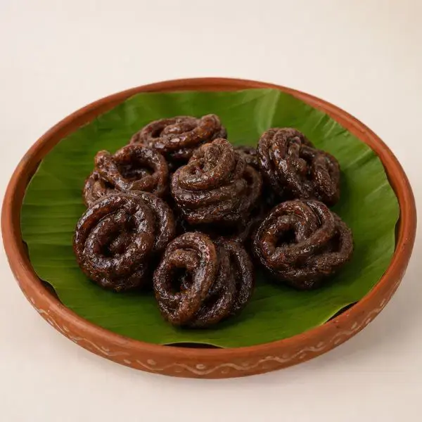 Traditional Jangiri sweets served on a green leaf plate.