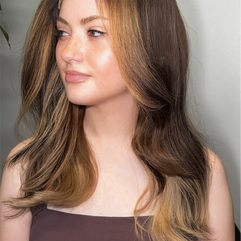 Confident woman wearing luxury hair extensions celebrating Women’s History Month