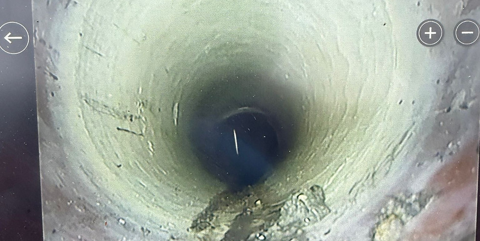 A repaired pipe after it had a fibreglass patch liner installed