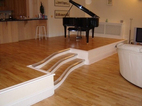 Custom wooden flooring with raised piano stage
