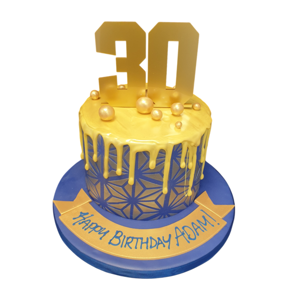 Vibrant and stylish cake with geometric designs and colourful drip, perfect for birthdays and celebrations.
