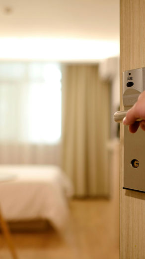 Someone Opening a Hotel Room Door