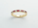 18 karat yellow gold ruby and diamond band