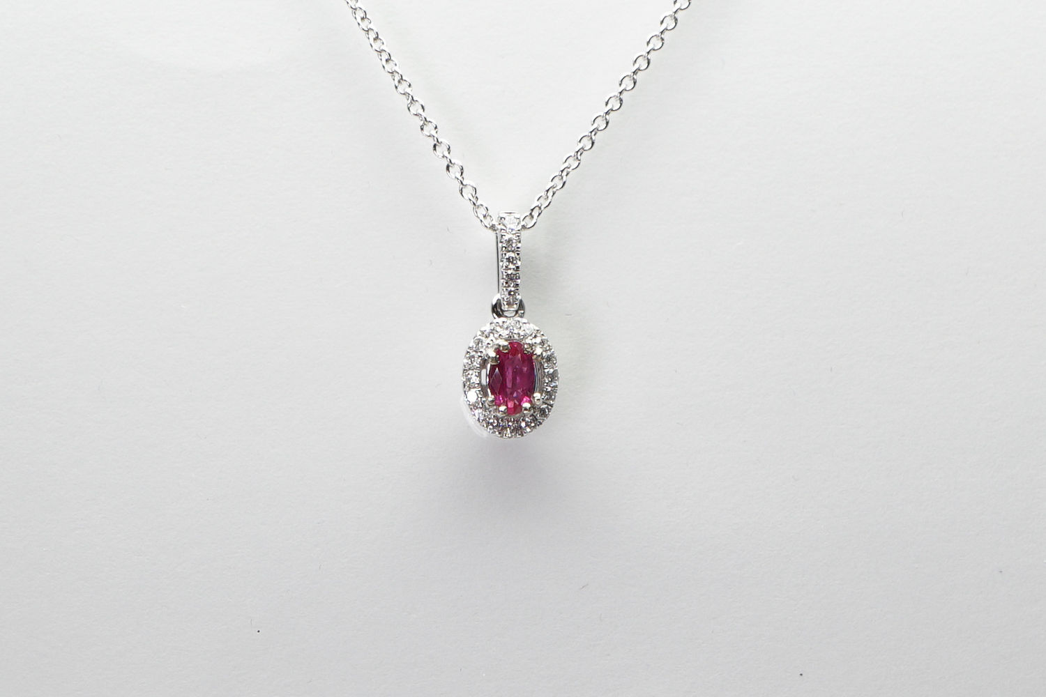 14 karat white gold ruby and diamond pendant