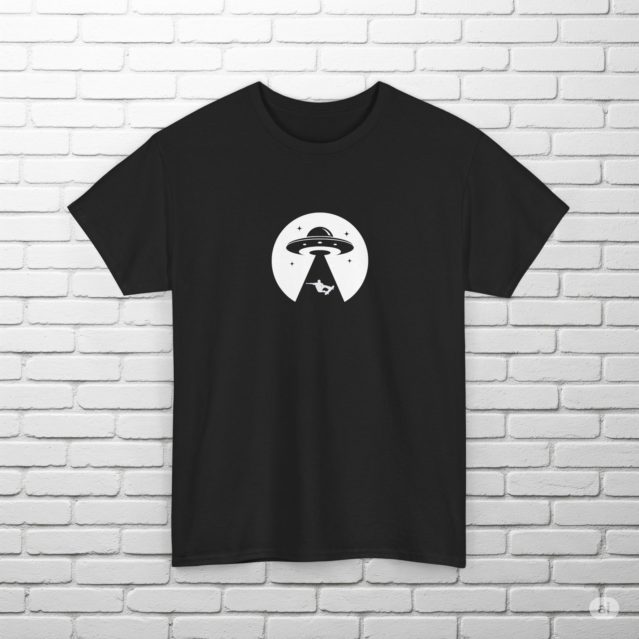 A black T-shirt featuring a graphic of a UFO beaming up a skateboarder, set against a circular white background