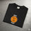 Thumbnail: A black t-shirt with a work from home logo and the words never forget printed in white