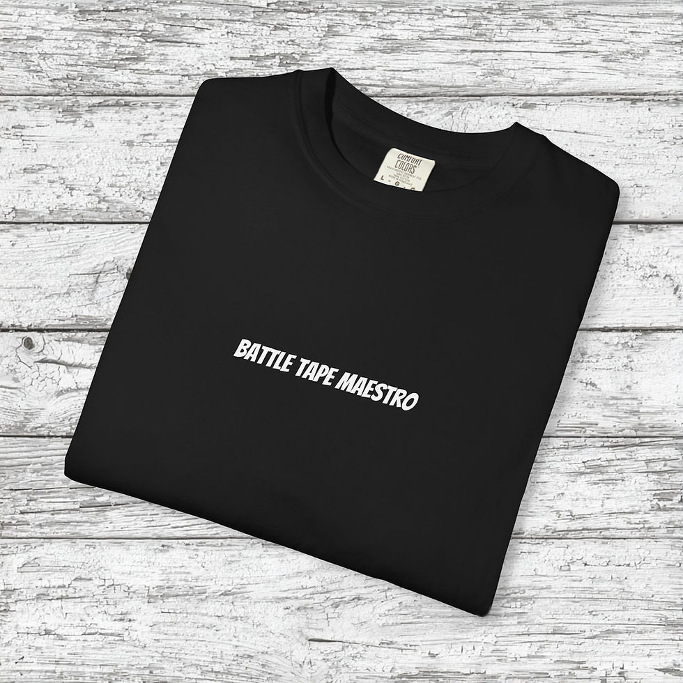 A black t-shirt with the phrase BATTLE TAPE MAESTRO printed in white, centered on the chest