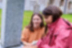Woman and child looking at a headstone at Muncaster Fringe.