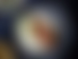 Crispy spiced salmon wraps filled with sour cream, pickled red onions, and pea shoots