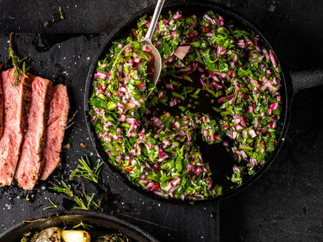 Bowl of fresh chimichurri made with parsley, chilli, garlic, and olive oil