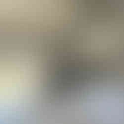 A white countertop with stainless wall