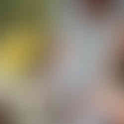 a woman picking up a mug