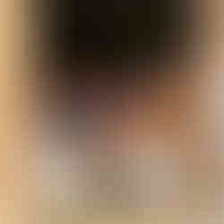 A group of chickens sit in the open doorway of a trailer