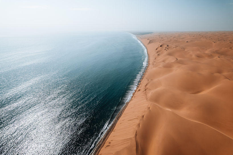 aerial-drone-where-desert-meets-the-ocean-sandwi-2026-03-24-12-53-38-utc.jpg