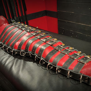 full body bondage harness, crafted entirely by hand from 2 inch wide latigo leather belts with locking pins and featuring 32 D rings
