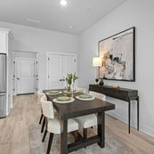 Kitchen and living area flow in Rogers AR townhome near entertainment district