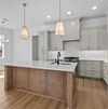 Kitchen island with pendant lighting – Bespoke Homes Hampton model