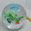 Thumbnail: 4.5" Round glass paperweights- internal flower and fish design