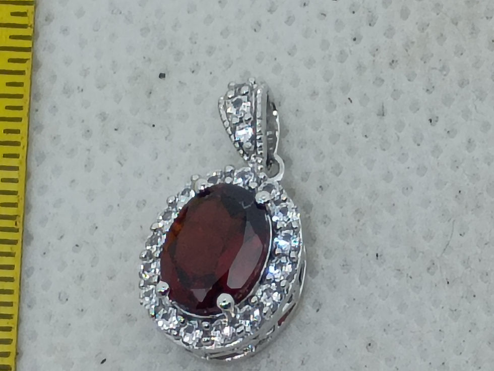 Thumbnail: .75" sterling silver pendant with a faceted amber or citrine gemstone