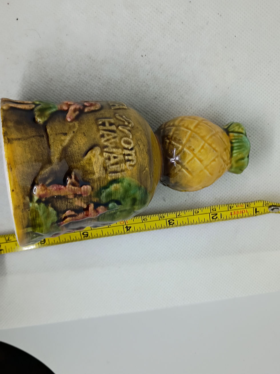 Thumbnail: 5" tall- Souvenir porcelain bell from Hawaii -scenes of skiiers and hula girls