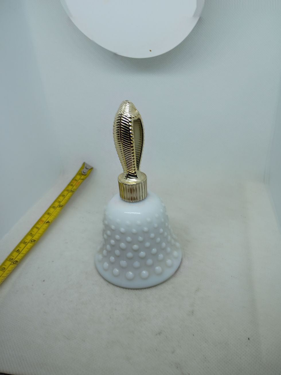 Thumbnail: Approx 5.5" tall- Topaz  Cologne white knobby glass bell- Avon 2oz - empty