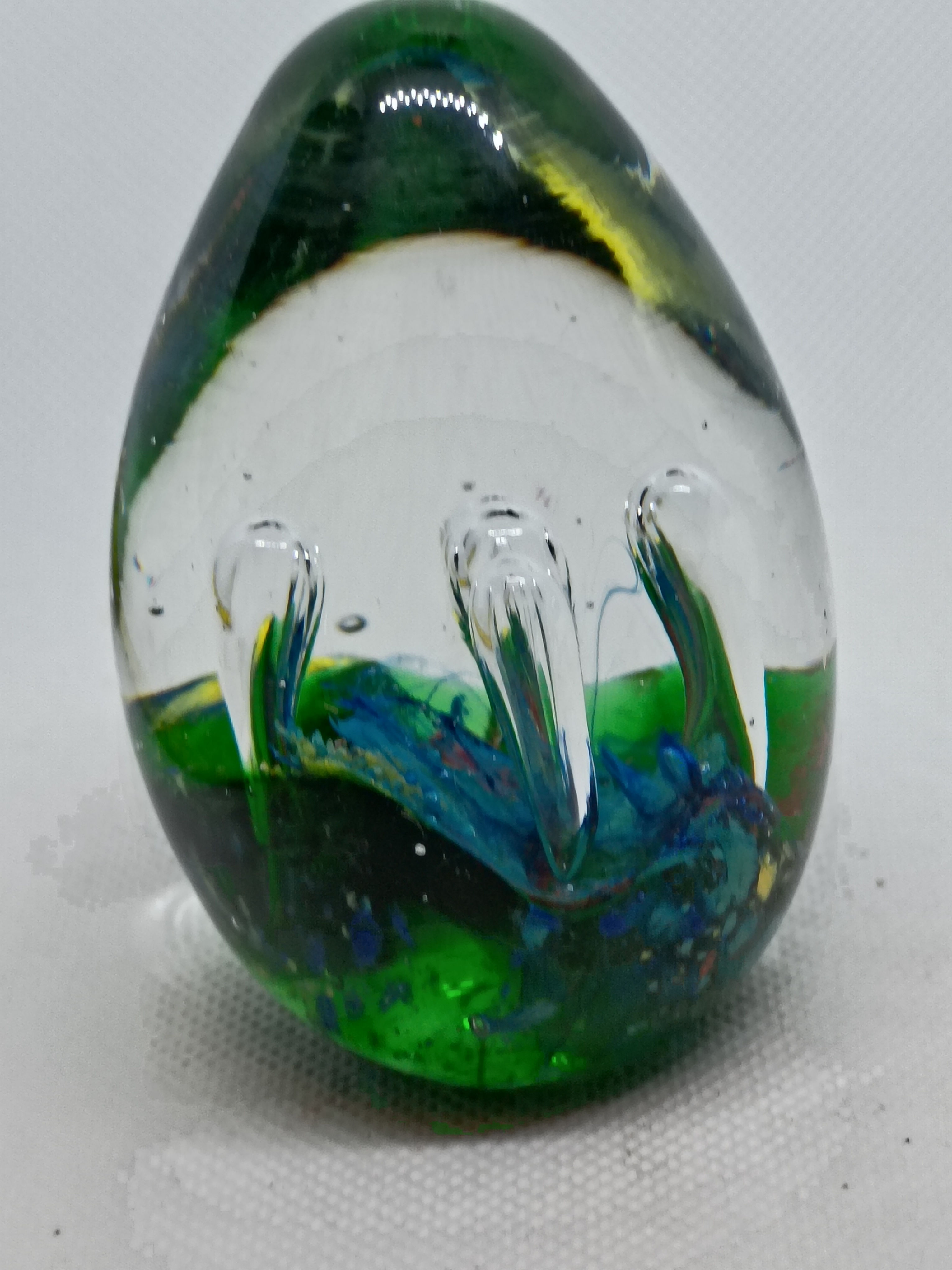 2.5" wide 3.5" tall egg shaped Clear glass paperweight- growing bubbles