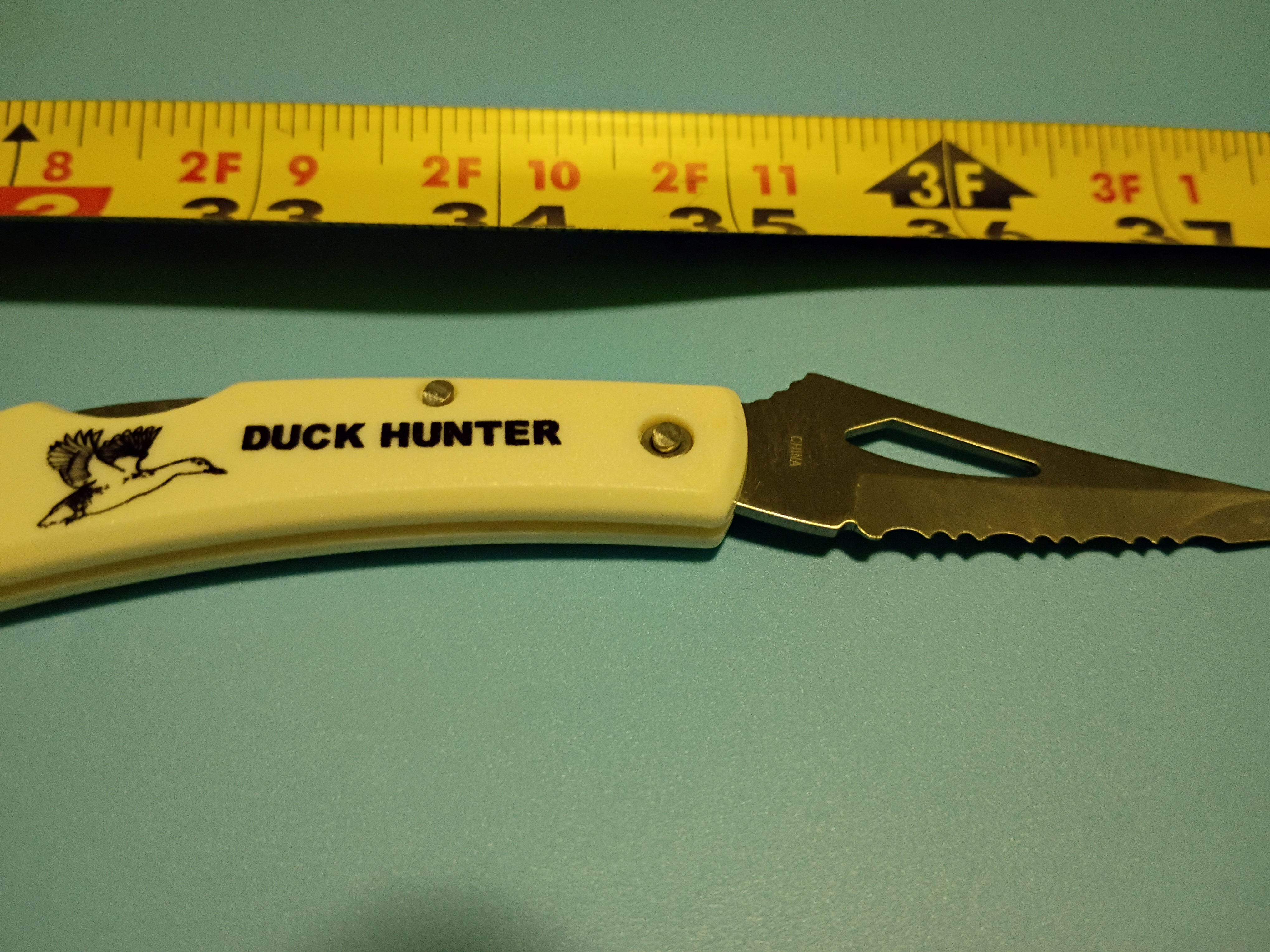 Approx 5" open -Folding knife- stainless steel blade- plastic handle Duck Hunter