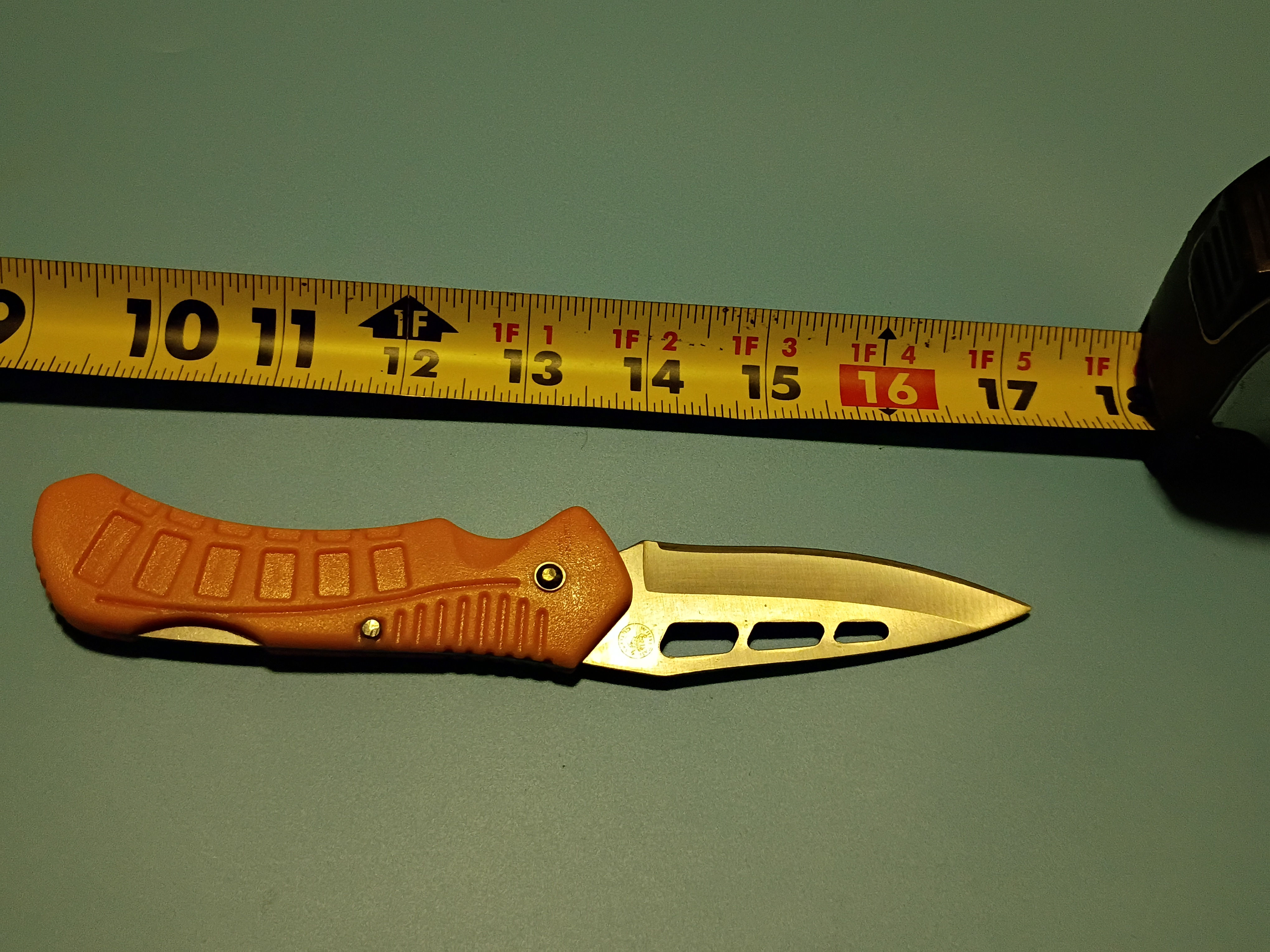 7" open - Folding knife -stainless steel lock back blade - orange plastic handle