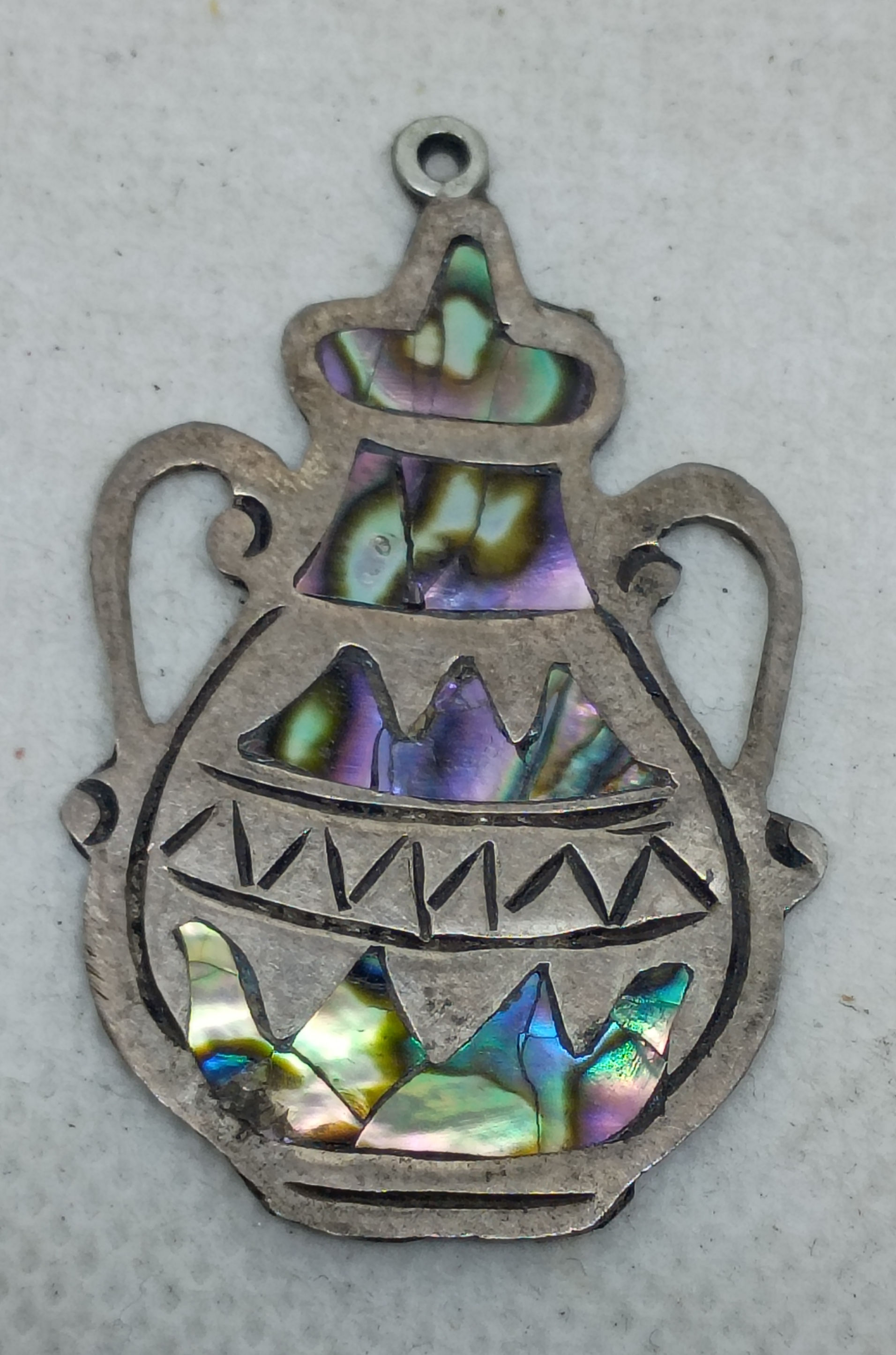 Approx.1.25" vintage Mexican silver figural brooch with iridescent abalone shell