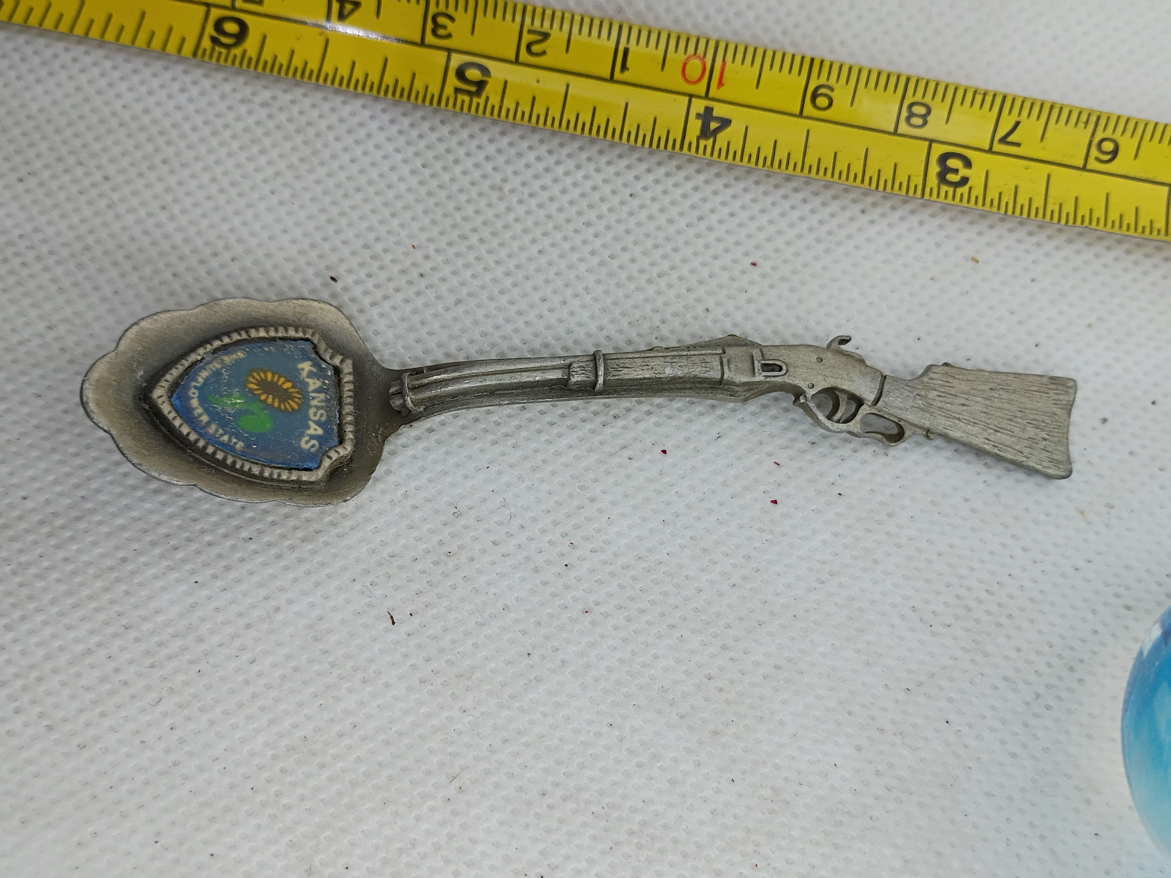 Approx. 4"-vintage Kansas souvenir spoon, rifle shaped handle w/ enameled shield