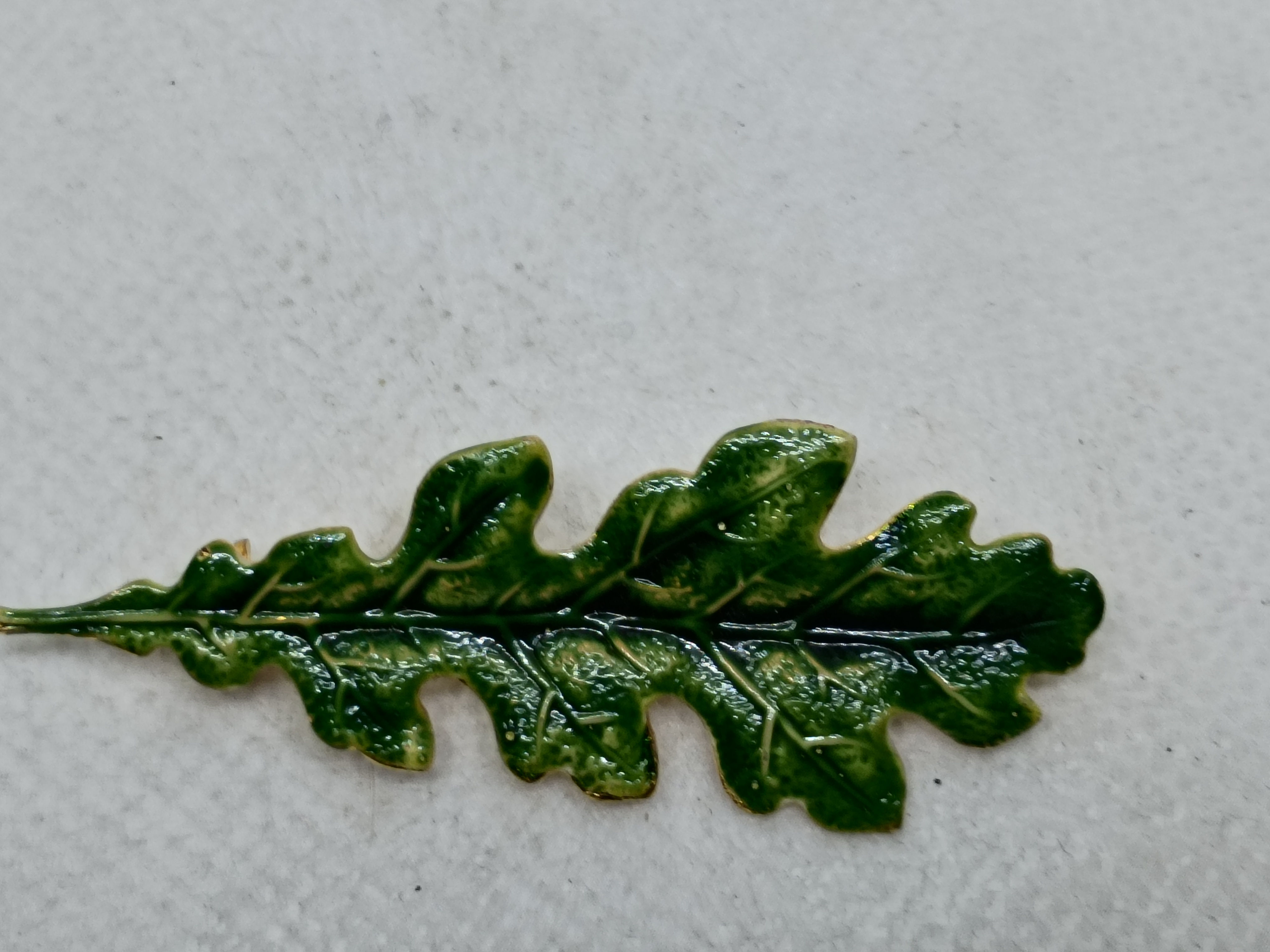 2" This is a intricate, glossy green enamel oak leaf lapel pin (or brooch)