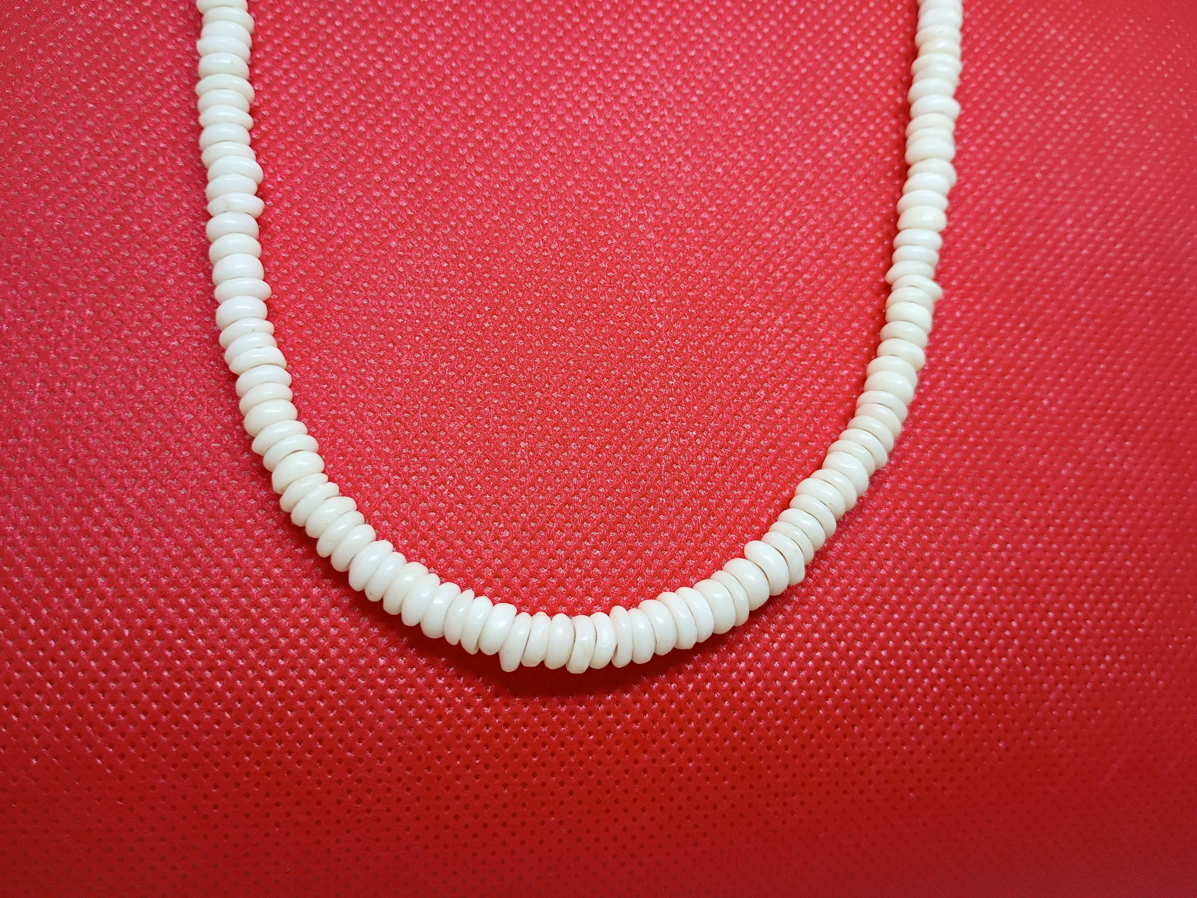 Approx.16" vintage white heishi shell necklace featuring a two-piece brass clasp