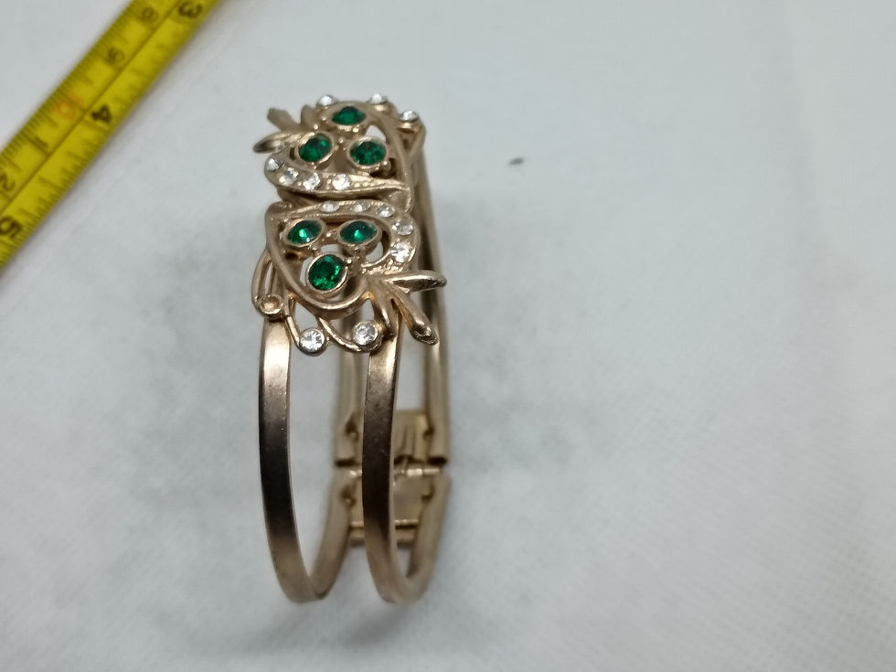 Thumbnail: Approx. 2.5"  gold-tone metal floral design adorned w/ green & clear rhinestones