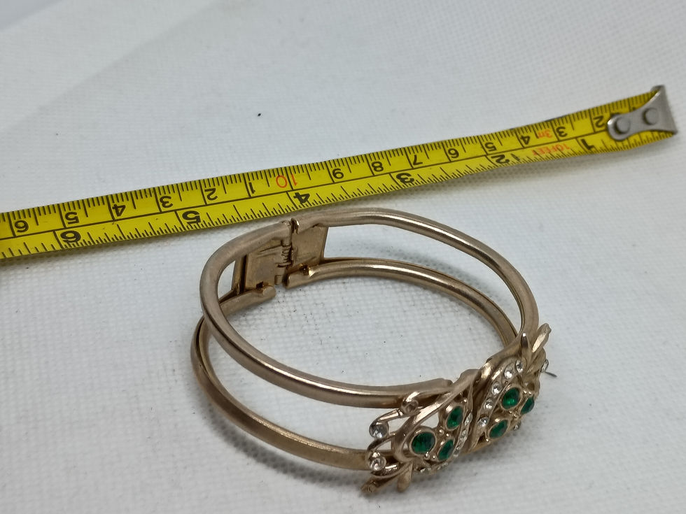 Thumbnail: Approx. 2.5"  gold-tone metal floral design adorned w/ green & clear rhinestones