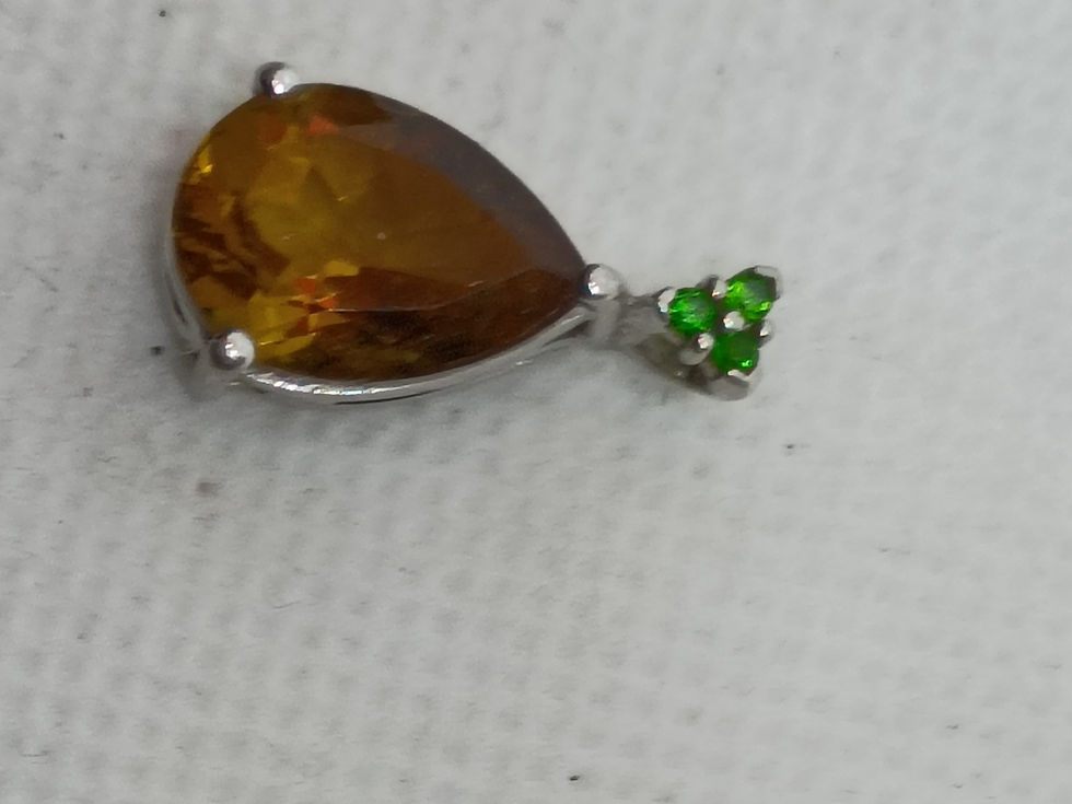 Thumbnail: Approx. 7/8" sterling silver pendant features a pear-shaped citrine gemstone
