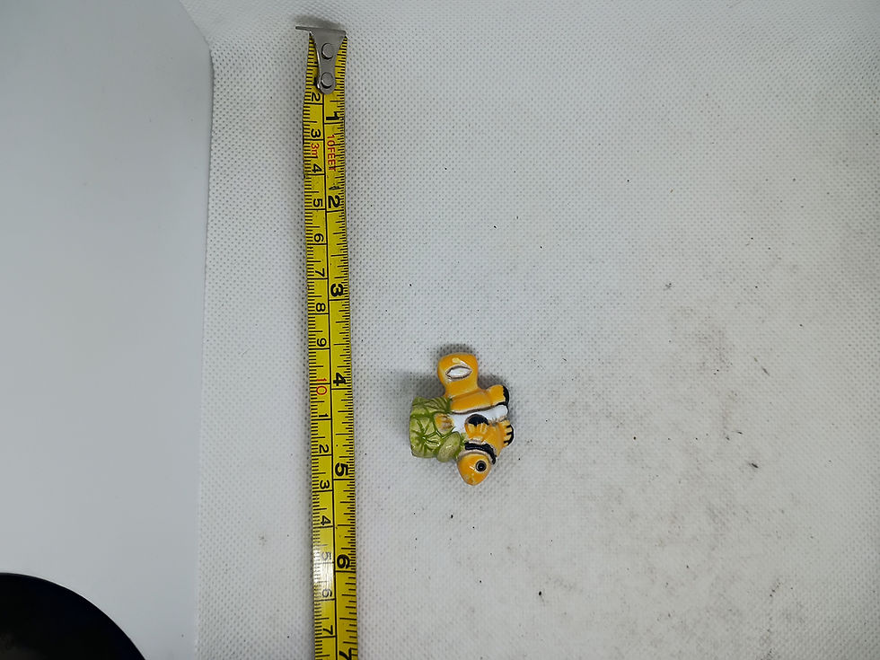 Thumbnail: 1.5" long - a small, hand-painted ceramic figurine