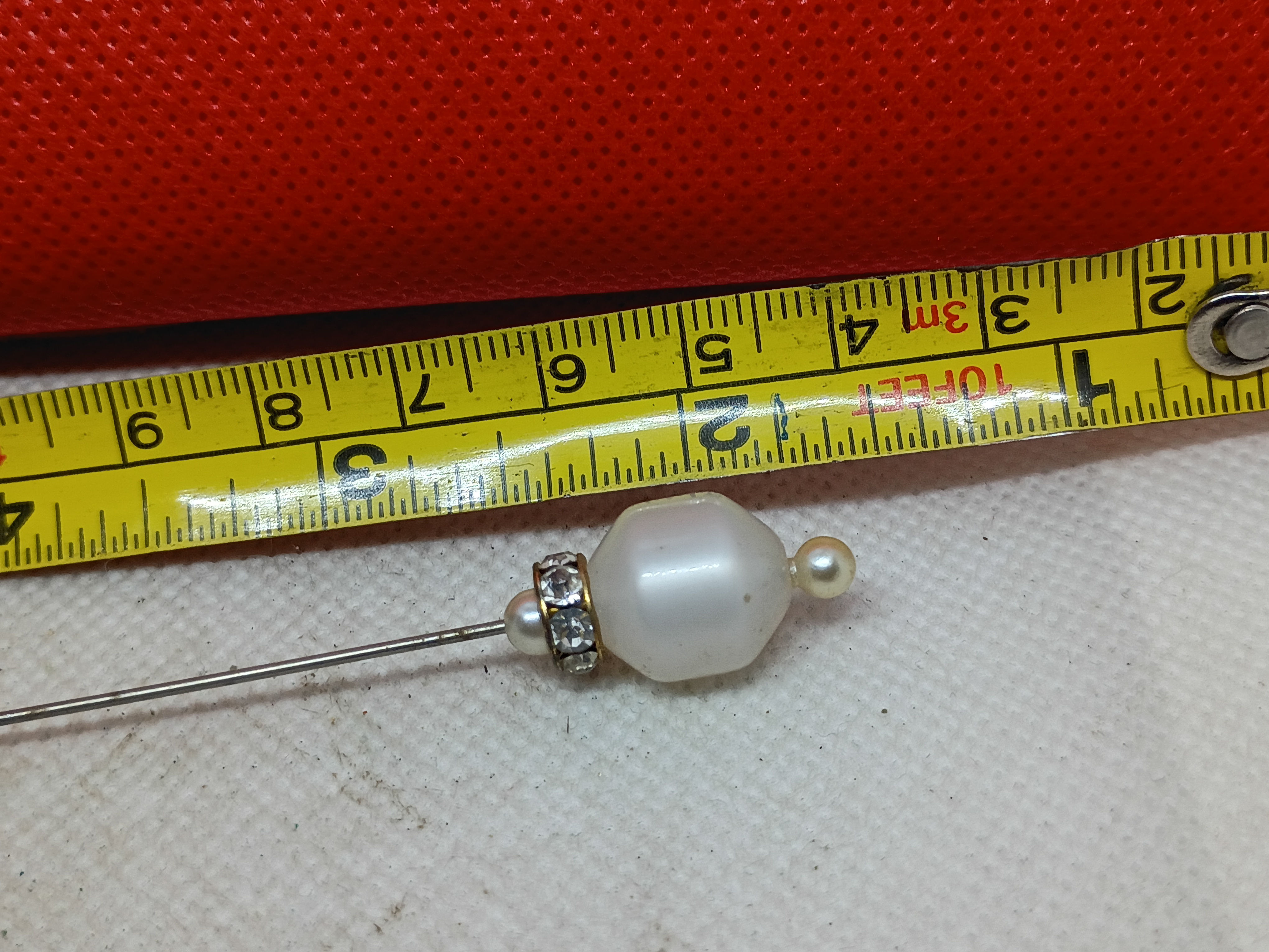 4" Vintage decorative hatpin with a faceted faux pearl accented by a rhinestone