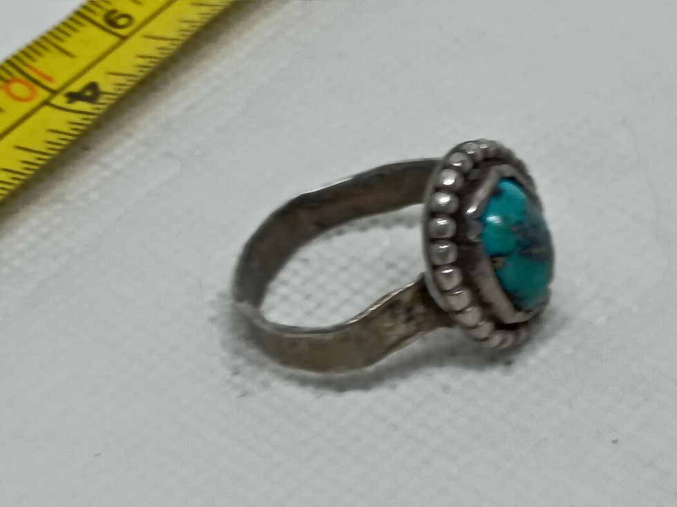 Thumbnail: This Navajo turquoise ring is crafted from sterling silver and a beaded edge