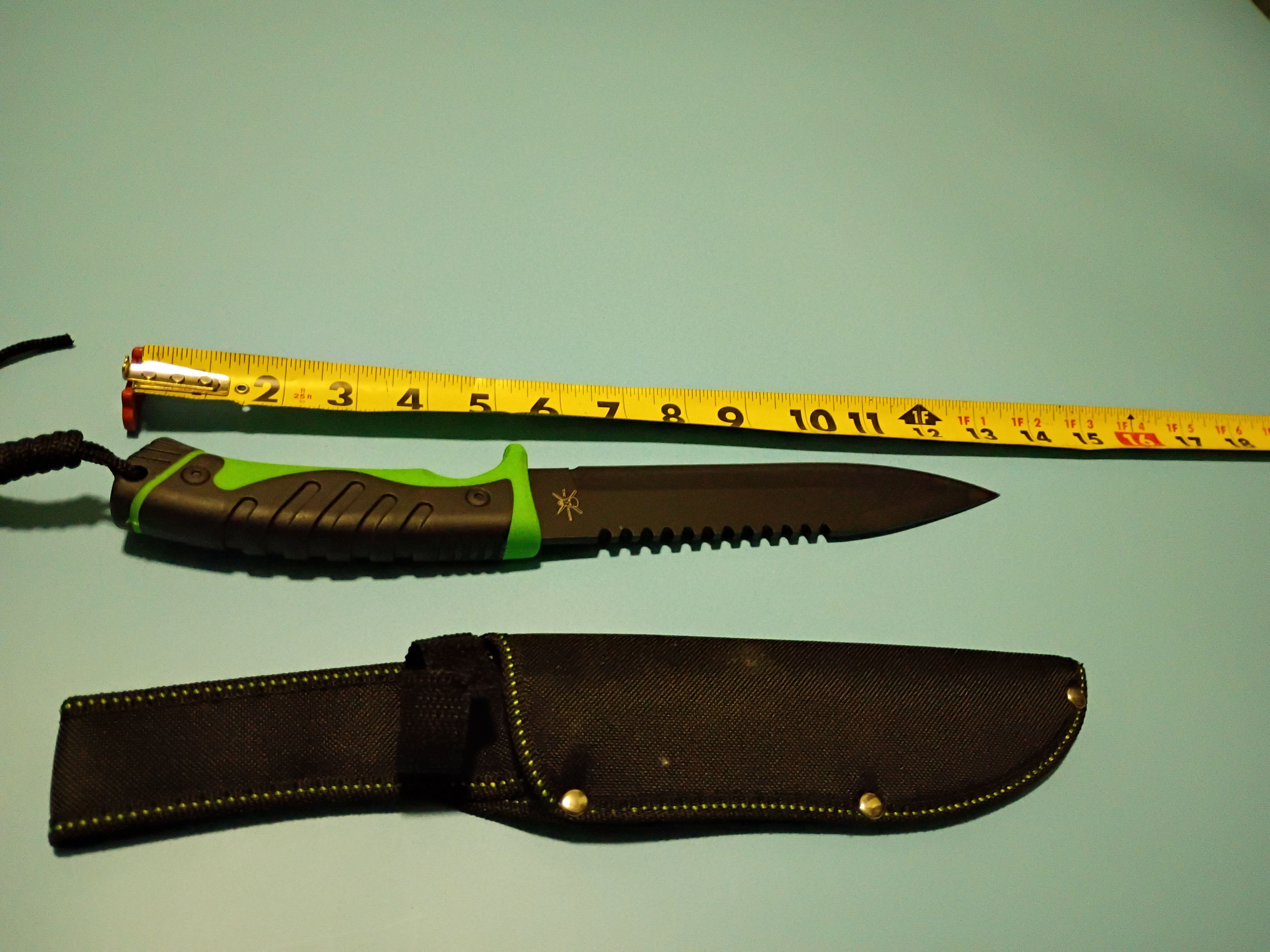 13" Black Stainless Steel blade - Green and black injected handle- Nylon sheath 
